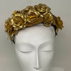Floral leather headband in gold.