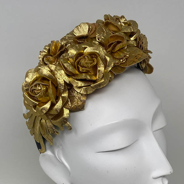 Floral leather headband in gold.